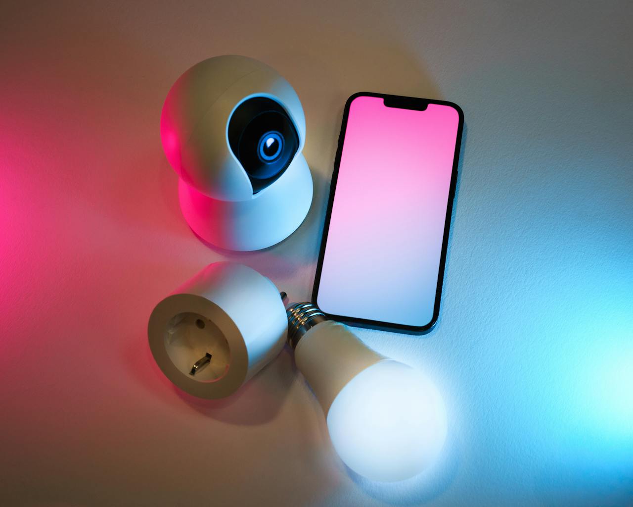 Explore smart home essentials: a smart camera, light bulb, and mobile app control.